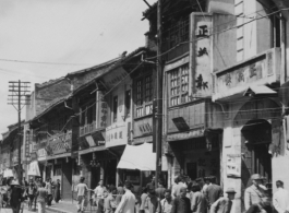 Street scene in a China city, mostly likely Kunming. During WWII.