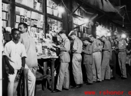 GIs lined up at magazine stand in Calcutta during WWII.