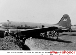 A C-46 transport plane, tail #112410, in a ditch because of brake failure at Kunming, China, during WWII. ICW-ATC, probably 1943.  Photo from Robert L. Cowan.