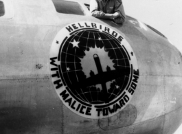 Clarence M. Miller leans from B-29 cockpit window. The 462th Bomb Group insignia reads "Hellbirds: With Malice Toward Some" around a B-29 silhouette.  (Despite the photo being labeled as 467th BS, there is no record of such a squadron being assigned to the 462nd Bombardment Group. ---Thanks to Al Schutte for the update!)  Photo from Clarence M. Miller.