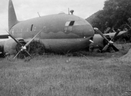 A C-46 hard on its belly in the CBI during WWII.  Photo from James Streitwieder.