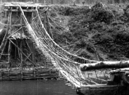 Pedestrian foot-bridge over water in the CBI during WWII.