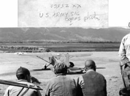 Three Chinese men observe a parked L-14 . Near Mitu, in the CBI during WWII.  U. S. Army Signal Corps Photo.