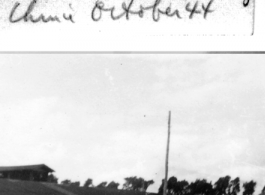 Malvin Nelson tries out a carrying pole at Hostel #3 near Kunming, October 1944.