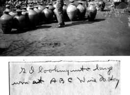 GI looks into large jug at ABC Wine Factory, near Kunming, China, March 1945.