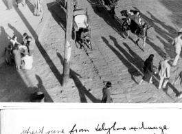 Street scene from angle of telephone exchange in Kunming, China, March 1945.