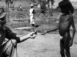 American soldier with child. Probably India 1942 or 1943.