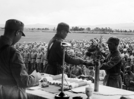 Chinese soldier of the 48th Army Division (陆军第四十八师) gets an award in a ceremony during a rally.