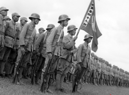 Chinese soldiers  of the 48th Army Division (陆军第四十八师, as noted on banner) stand in rank during rally