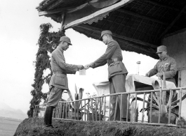 Chinese soldier of the 48th Army Division (陆军第四十八师) gets an award in a ceremony during a rally.