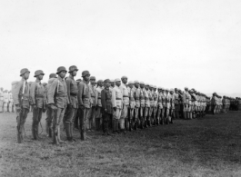 Chinese soldiers standing in ranks during exercises in southern China, probably Yunnan province, or possibly in Burma.