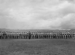 Chinese soldiers stand in ranks during exercises in southern China, probably Yunnan province, or possibly in Burma.