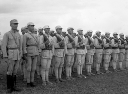 Chinese soldiers standing in ranks during rally.