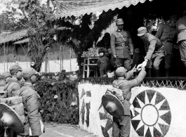 Chinese soldiers during in a ceremony as part of a shooting contest ("射击比赛)" in southern China, probably Yunnan province, or possibly in Burma.