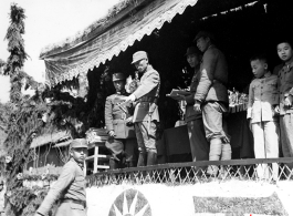 Chinese soldiers during in a ceremony as part of a shooting contest (射击比赛) in southern China, probably Yunnan province, or possibly in Burma.