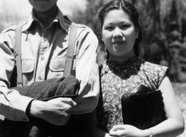 VIP Chinese couple pose for the camera on day outing.