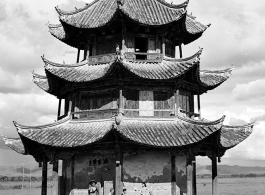 Western and Chinese friends chat at a pavilion in Songming county during WWII.