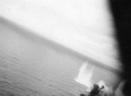 Bomb hit on Japanese ship, likely in South China Sea. A clearly very destructive hit on Japanese shipping by B-25 Mitchell bombers.