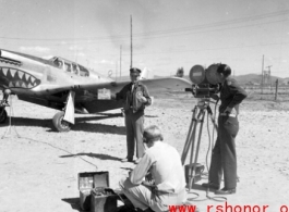 An American GI being filmed in front of a P-51. From the collection of Hal Geer.