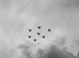 A formation of B-25 Mitchell bombers above in flight in the CBI, in the area of southern China, Indochina, or Burma.