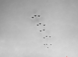 B-25 Mitchell bombers above in flight in the CBI, in the area of southern China, Indochina, or Burma.