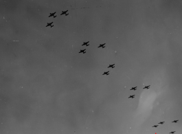 B-25 Mitchell bombers in flight in the CBI, in the area of southern China, Indochina, or Burma.