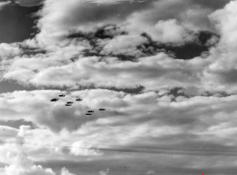 B-25 Mitchell bombers in flight in the CBI, in the area of southern China, Indochina, or Burma.