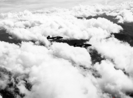 B-25 Mitchell bombers in flight in the CBI, in the area of southern China, Indochina, or Burma.