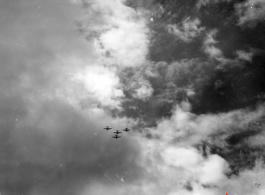 Four B-25 Mitchell bombers in flight in the CBI, in the area of southern China, Indochina, or Burma.