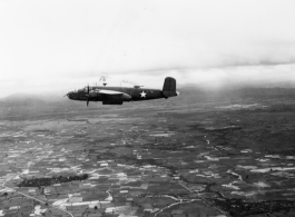 B-25 Mitchell bombers in flight in the CBI, in the area of southern China, Indochina, or Burma.