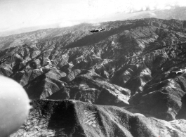 B-25 Mitchell bombers fly in the CBI, probably over SW China or Burma, during WWII.