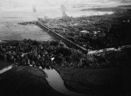 B-25 Mitchell bombers do battle with Japanese ground forces, flying over Tengchung (Tengchong), near the China-Burma border in far SW China.