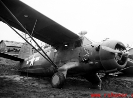 A C-64, tail number #35302, tipped into a ditch after a tornado on the flight line at Shamshernagar, Assam (India).  From the collection of David Firman, 61st Air Service Group.