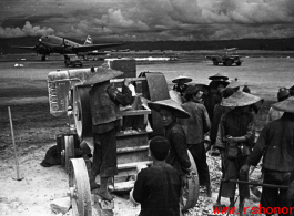 Chinese workers crush limestone for gravel and other construction needs at an American air base, Luliang.