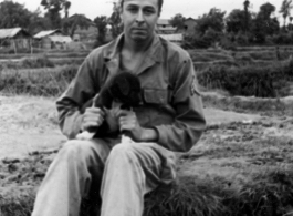 GI holding a dog in Yunnan province, China.