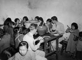 Chaplain Mengel lead his men to participate in outreach to the wartorn and impoverished Chinese countryside. These photos from Chaplain Mengel's private collection, show him with General Chennault, giving out donations from the US airmen.