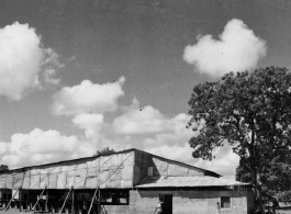 Covered theater area in India.  Scenes in India witnessed by American GIs during WWII. For many Americans of that era, with their limited experience traveling, the everyday sights and sounds overseas were new, intriguing, and photo worthy.