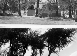 Countryside and small thatched buildings, possibly homes.  Scenes in India witnessed by American GIs during WWII. For many Americans of that era, with their limited experience traveling, the everyday sights and sounds overseas were new, intriguing, and photo worthy.