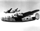 B-24s flying in a group. Possible tail-number of closest, nicknamed "Joney Bounce," is #124228. In the CBI.