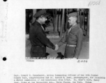 Capt. Howard W. Pennebaker of the 16th Combat Camera Unit congratulation 2nd Lt. Harold E. Geer on direct commision from T/Sgt. to 2nd Lt. January 11, 1945, in the CBI.