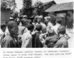 Lt. Vernon Swanson, profile, center, in downtown Qionglai (Kiunglai), China, about 30 miles from Chengtu, during WWII. GI were with the 462nd Bomb Group, 768th Squadron (B-29s).