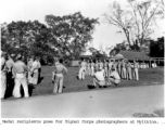 Medal recipients pose for Signal Corps photographers at Myitkina.  Photo form C. W. Leipnitz.