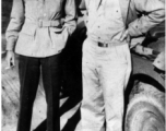 Chief Flight Surgeon, Col. Donald A. Flickinger, ATC (left), poses with W/O Fred "Pop" Henley, Sanitary Engineer, at a tea plantation near Tezpur, India, in December 1944.