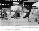 Joseph Johnston and Milfred Piper standing in a gate at Luliang, China, during WWII.  Photo from Marion Crawley.