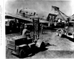 "Loading or unloading a jeep on or off of a C-46, obviously somewhere in the CBI."  Photo from Al Grasi.