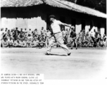 Major General Claire Chennault pitches for his team during a baseball game on November 1, 1944, in Kunming China.