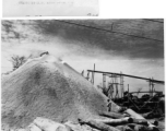 Saw dust pile at Army lumber mill during WWII in the CBI.