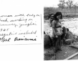 A woman working with a baby on her back on the runway at Yangkai, 1945.  Bienaime.