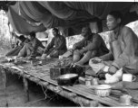 Nationalist soldiers convalesce on a bamboo platform covered in mosquito netting during WWII.