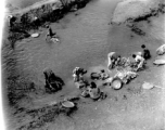 Local people wash vegetables and clothes in Yunnan province, China, during WWII.